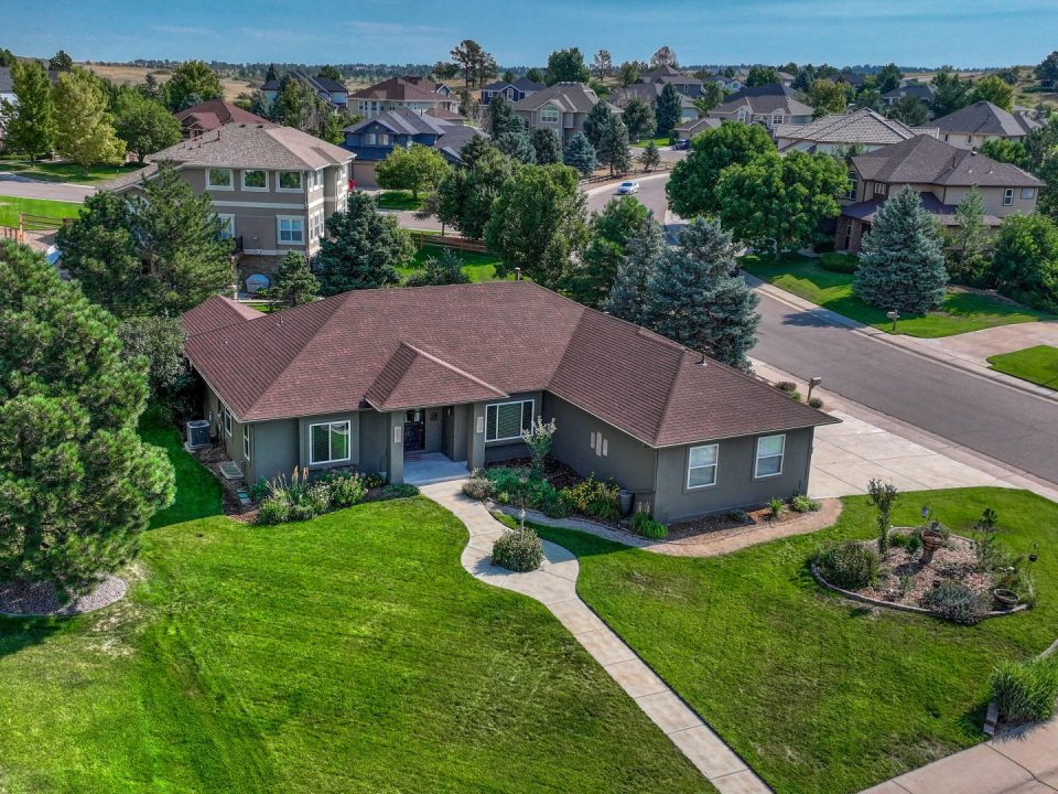 Aerial exterior of the ranch home at 7170 Windwood Way Parker CO
