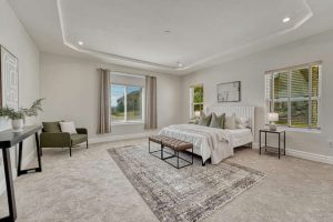 Main level primary bedroom at 7170 Windwood Way Parker Colorado with spacious layout and natural light