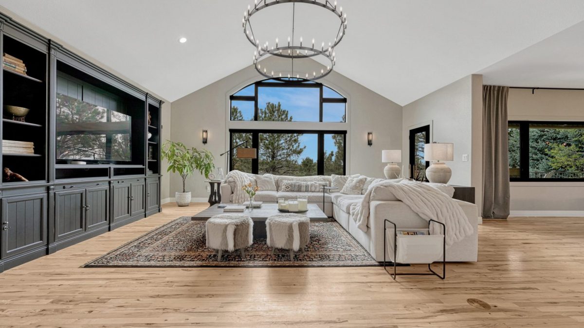 Open family room with soaring ceilings and large windows at 8422 Gopher Court Parker CO
