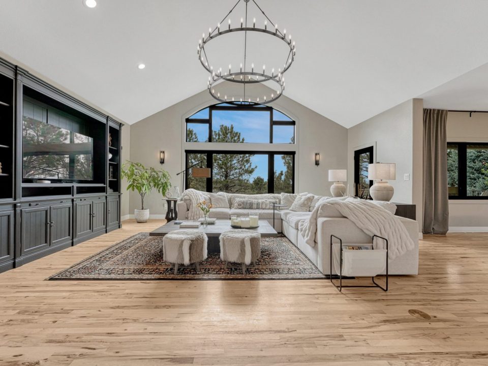 Open family room with soaring ceilings and large windows at 8422 Gopher Court Parker CO