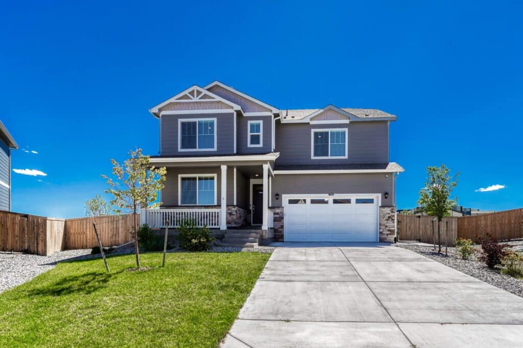 Spacious home at 17964 Sky Pilot Lane in Trails at Crowfoot, Parker Colorado, featuring a landscaped backyard.