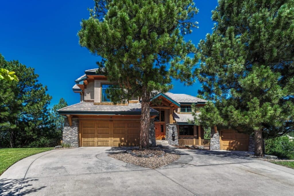 Beaver Creek-style luxury custom home at 5181 Warbler Court in The Timbers, Parker Colorado, on a mountain-view cul-de-sac lot.