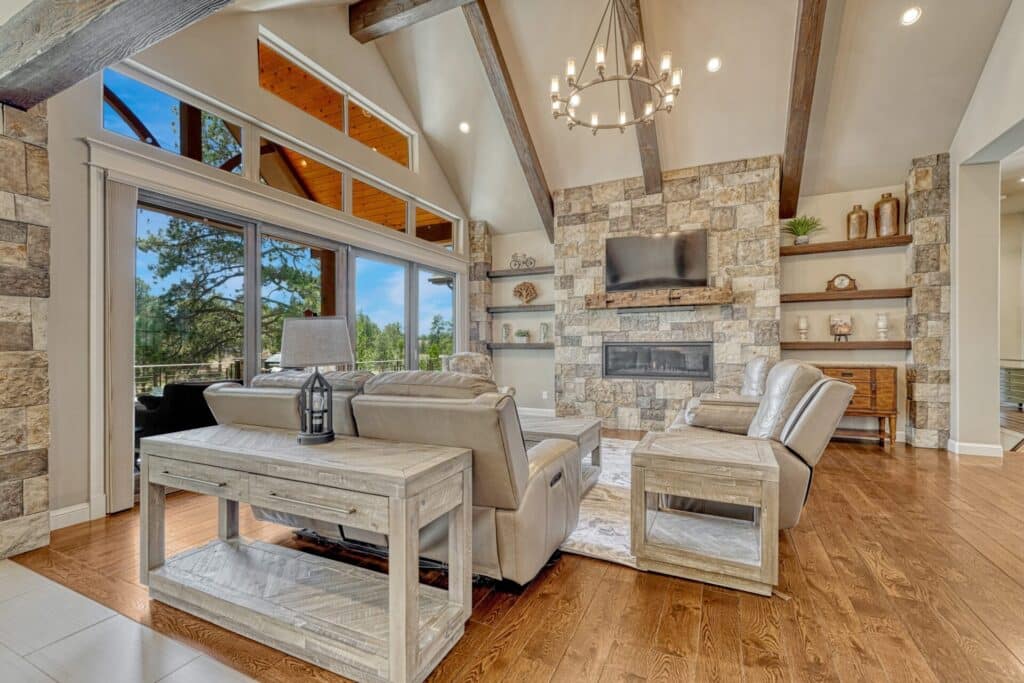 Sterling Custom Homes luxury ranch at 5732 Regal Oak Lane in The Timbers, surrounded by mature Ponderosa pines.
