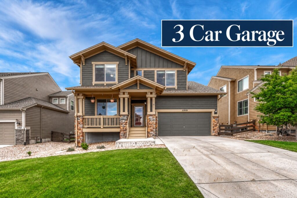 Spacious two-story home at 11919 S Meander Way in Idyllwilde, Parker Colorado, with a three-car tandem garage.